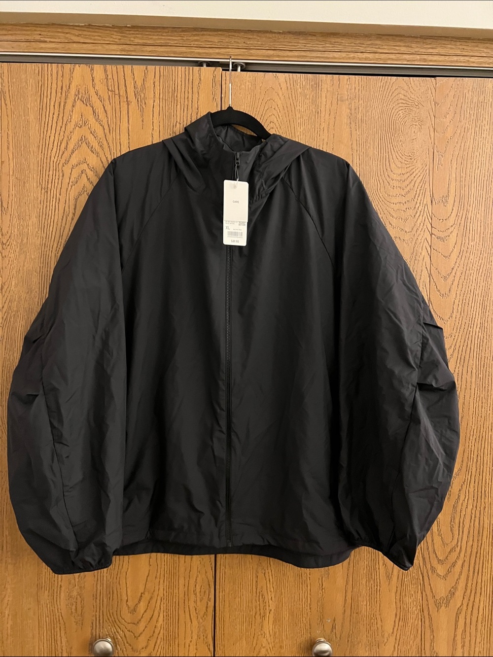 Uniqlo Men's Black Packable Hooded Windbreaker Jacket - Lightweight